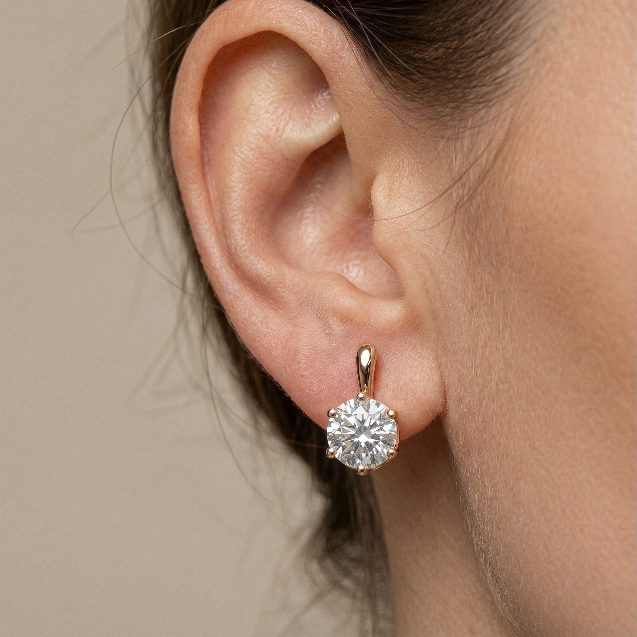 Person in white dress holding black jacket, walking outdoors.
